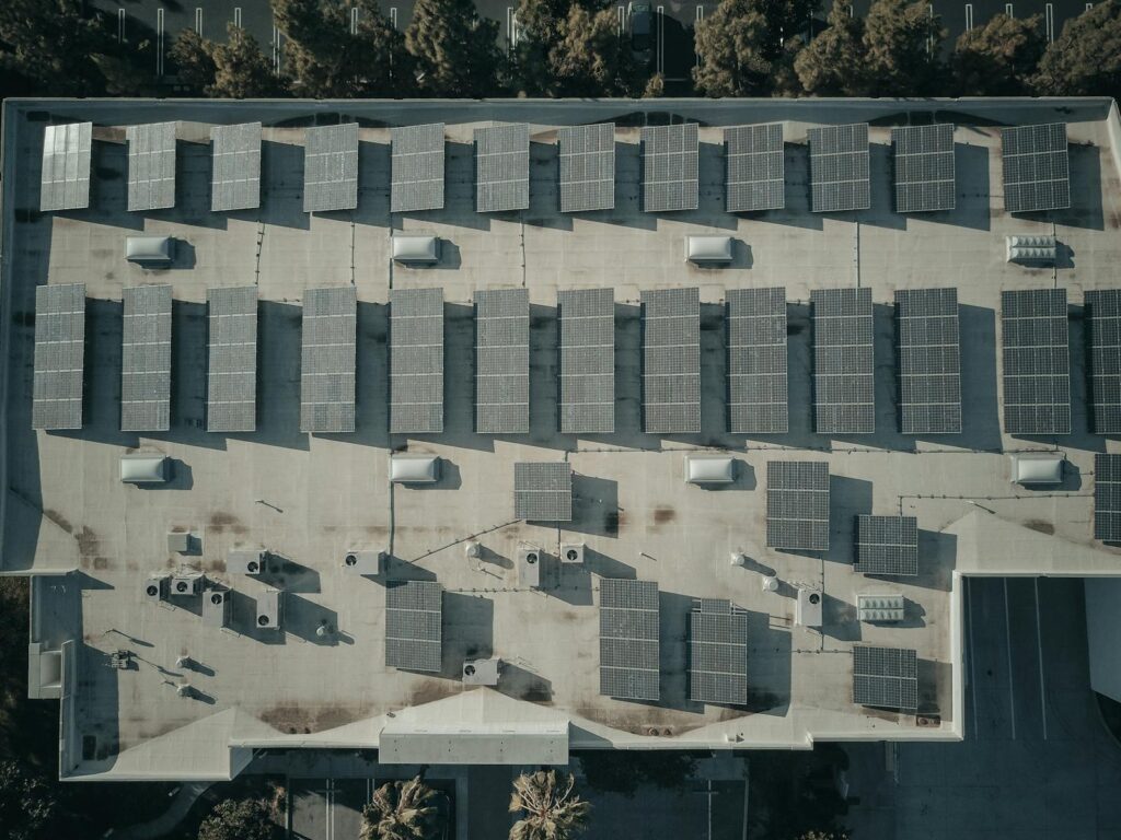 Aerial view of rooftop solar panels on a commercial building