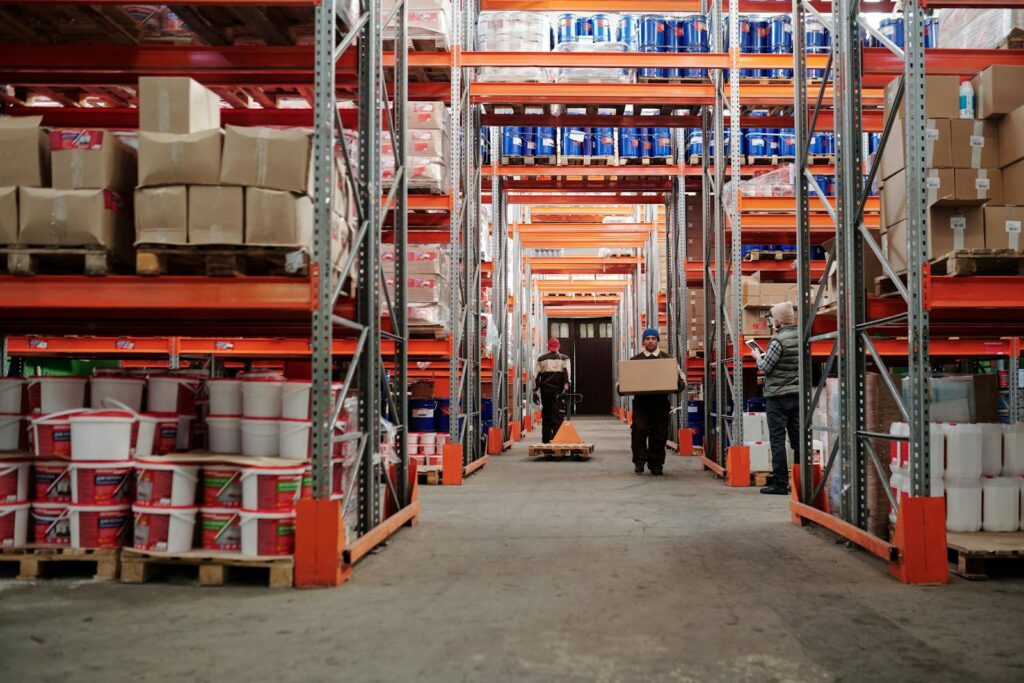 Warehouse team handling inventory inside a large logistics facility